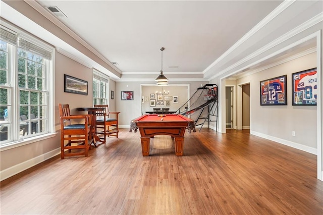 game room with billiards, visible vents, a tray ceiling, light wood-style floors, and crown molding