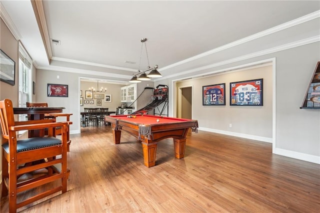 game room with pool table, crown molding, baseboards, light wood-type flooring, and an inviting chandelier