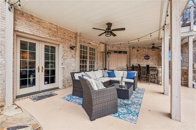 view of patio featuring french doors, outdoor dry bar, ceiling fan, and outdoor lounge area