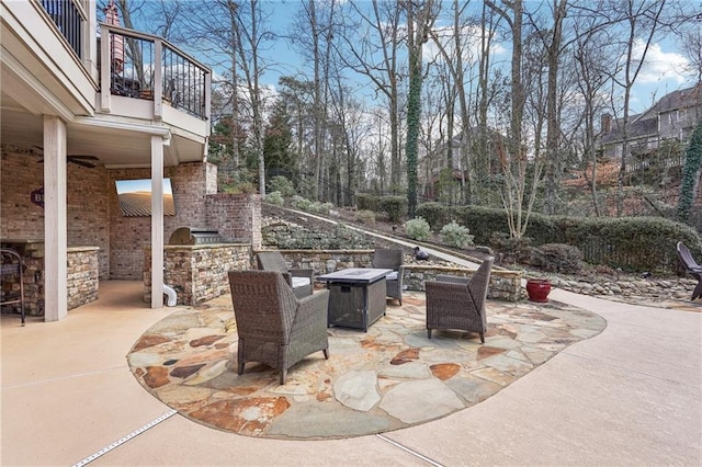 view of patio / terrace with exterior kitchen and a balcony