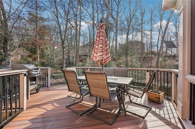 deck with outdoor dining area