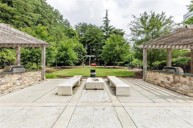 795 Hammond Dr Unit 503, Sandy Springs, GA 30328 - view of patio / terrace featuring a pergola, exterior kitchen, and an outdoor fire pit