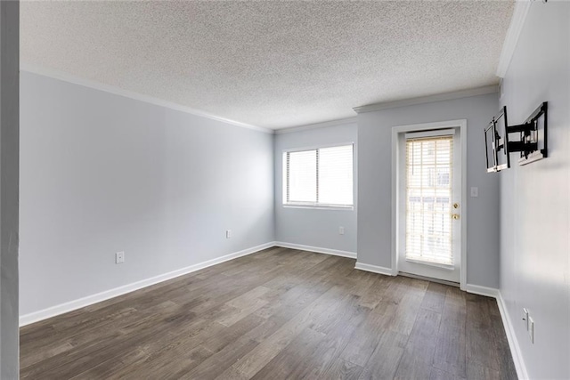 795 Hammond Dr Unit 503, Sandy Springs, GA 30328 - empty room featuring a textured ceiling, ornamental molding, and dark wood-type flooring