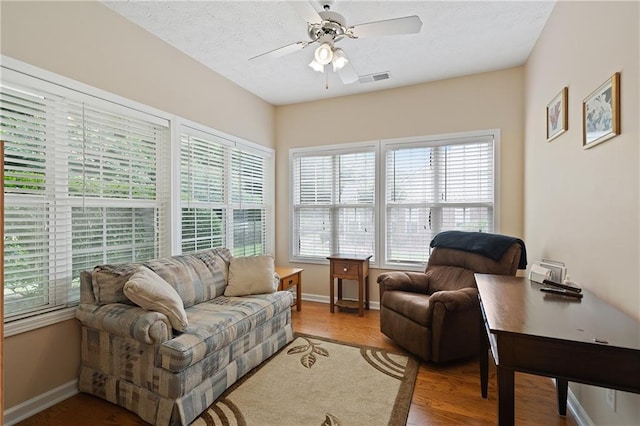 3734 Villa Springs Cir, Powder Springs, GA 30127 - living room with wood finished floors, a ceiling fan, and baseboards