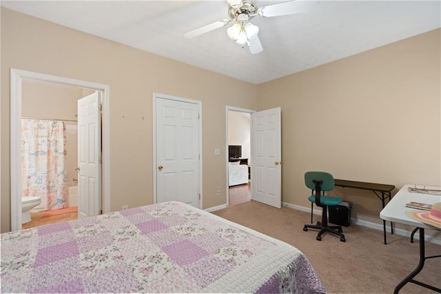 3734 Villa Springs Cir, Powder Springs, GA 30127 - carpeted bedroom featuring baseboards, a ceiling fan, and ensuite bathroom