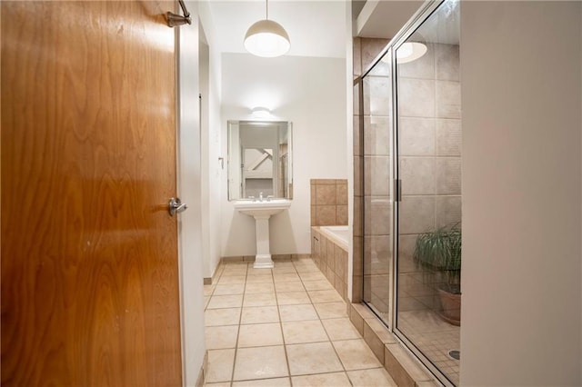 1596 Cleveland Ave Unit 301, East Point, GA 30344 - full bathroom featuring tile patterned floors, tiled shower, and a relaxing tiled tub