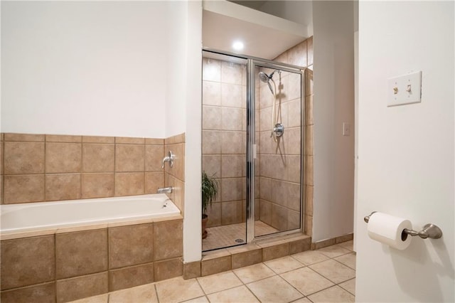 1596 Cleveland Ave Unit 301, East Point, GA 30344 - full bath featuring a bath, a shower stall, and tile patterned flooring