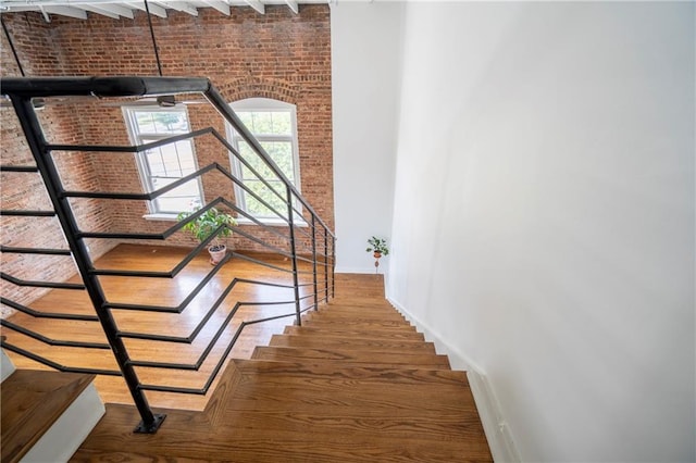 1596 Cleveland Ave Unit 301, East Point, GA 30344 - stairway featuring brick wall and a towering ceiling