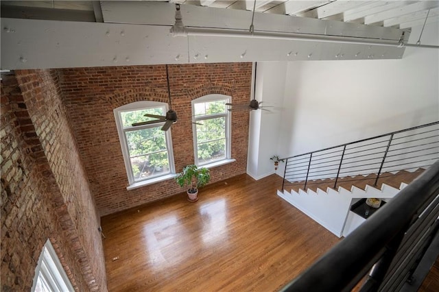 1596 Cleveland Ave Unit 301, East Point, GA 30344 - stairway featuring wood finished floors and brick wall