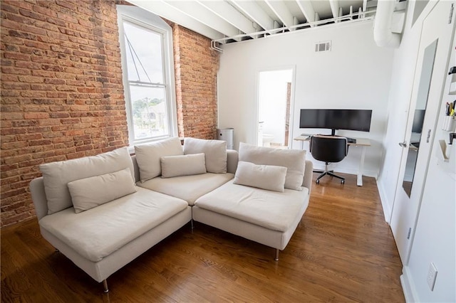1596 Cleveland Ave Unit 301, East Point, GA 30344 - living room featuring brick wall, an office area, and wood finished floors