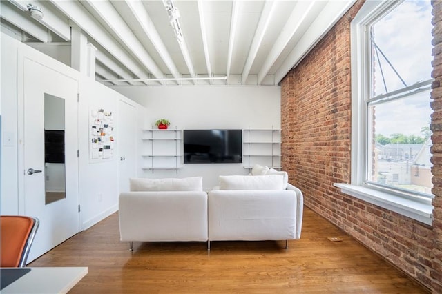 1596 Cleveland Ave Unit 301, East Point, GA 30344 - living area with brick wall and light wood-type flooring