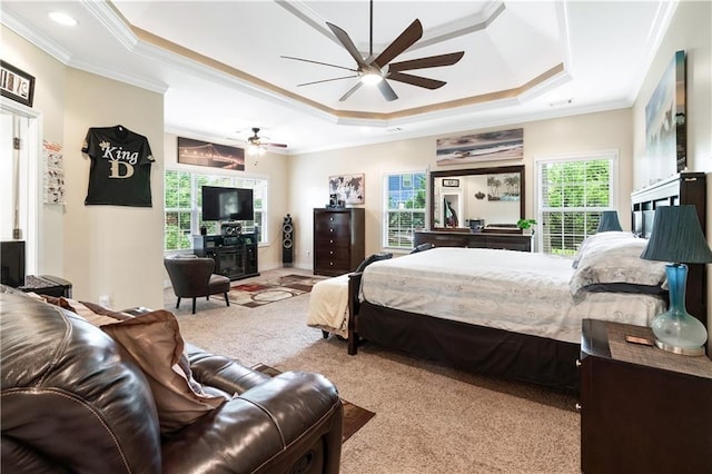 bedroom featuring ornamental molding, carpet, and a raised ceiling