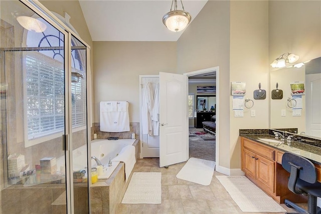 full bathroom featuring a stall shower, tile patterned floors, a whirlpool tub, vanity, and high vaulted ceiling