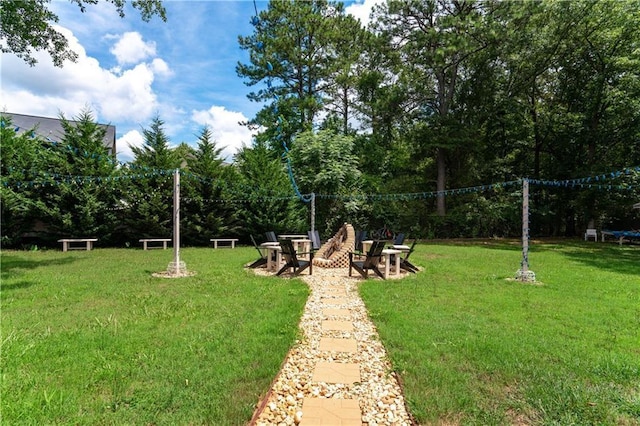 view of yard with an outdoor fire pit