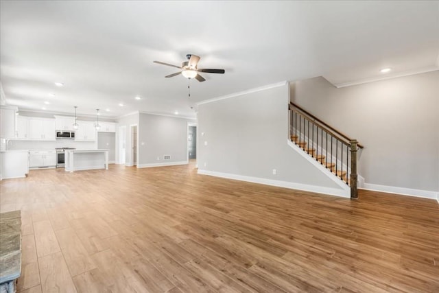 unfurnished living room featuring ceiling fan, crown molding, and light hardwood / wood-style floors