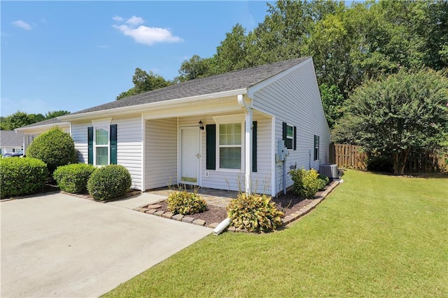 single story home featuring central AC and a front lawn