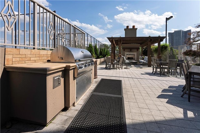 2795 Peachtree Rd NE Unit 1009, Atlanta, GA 30305 - view of patio / terrace with an outdoor fireplace and a pergola