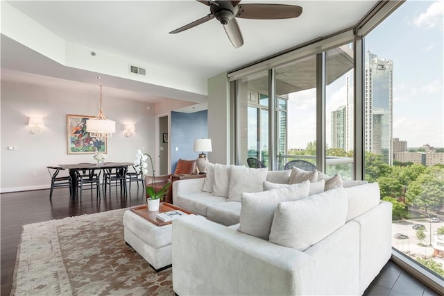 2795 Peachtree Rd NE Unit 1009, Atlanta, GA 30305 - living room with healthy amount of natural light, a ceiling fan, floor to ceiling windows, baseboards, and dark wood finished floors