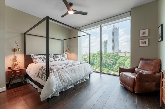 2795 Peachtree Rd NE Unit 1009, Atlanta, GA 30305 - bedroom with a wall of windows, wood finished floors, a view of city, and a ceiling fan