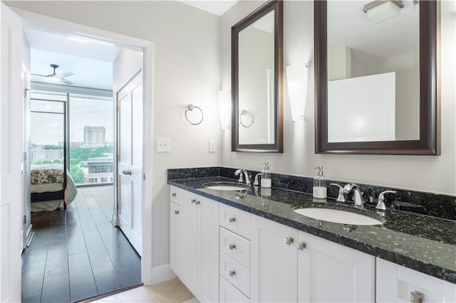 2795 Peachtree Rd NE Unit 1009, Atlanta, GA 30305 - bathroom with double vanity, a ceiling fan, ensuite bathroom, and baseboards