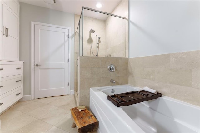 2795 Peachtree Rd NE Unit 1009, Atlanta, GA 30305 - bathroom with tiled shower, a bath, tile patterned floors, and recessed lighting