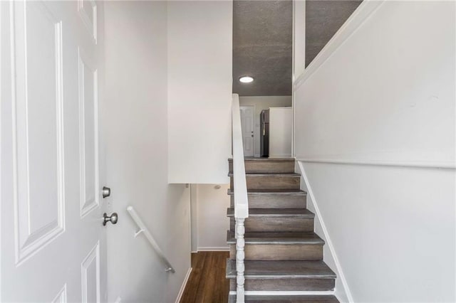 stairs with hardwood / wood-style flooring