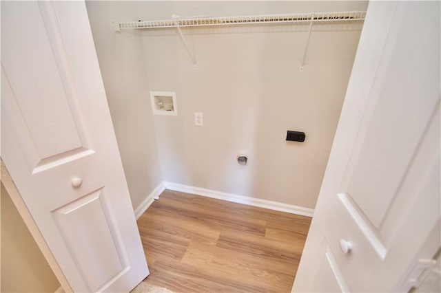 laundry area with laundry area, washer hookup, wood finished floors, baseboards, and electric dryer hookup