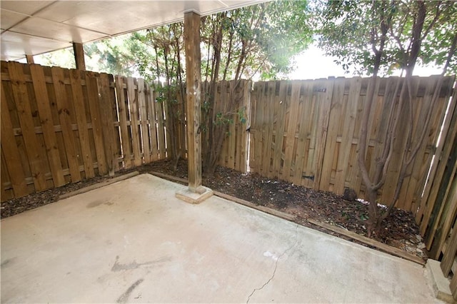 view of patio / terrace featuring fence