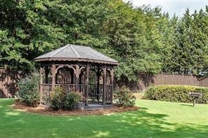 view of yard featuring fence and a gazebo