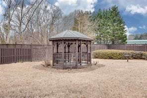 view of yard featuring a fenced backyard and a gazebo