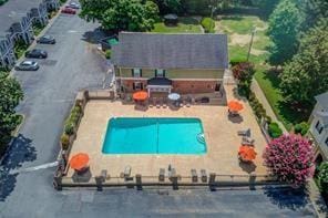 community pool featuring a patio area