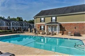 community pool with a patio