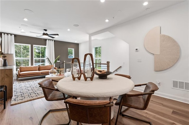 dining space featuring recessed lighting, a healthy amount of sunlight, and wood finished floors