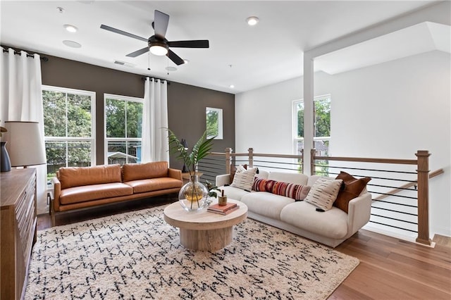 living area with visible vents, recessed lighting, a ceiling fan, and wood finished floors