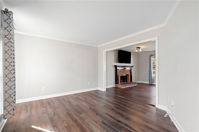 unfurnished living room with dark wood-style floors, a brick fireplace, baseboards, and ornamental molding