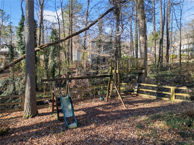 view of jungle gym with fence