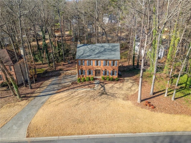 colonial inspired home with driveway