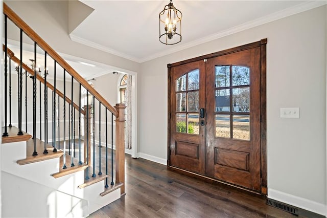 entryway featuring visible vents, dark wood-type flooring, ornamental molding, stairway, and baseboards