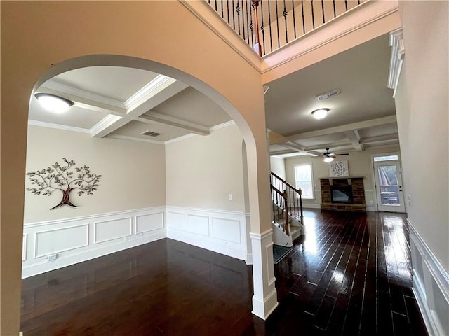 hallway with dark hardwood / wood-style floors, coffered ceiling, and beamed ceiling