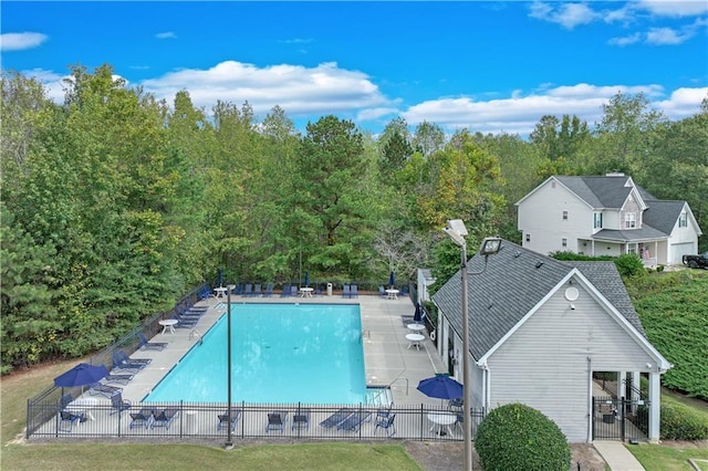 pool featuring a patio and fence