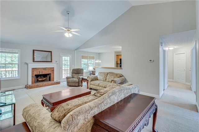 living room featuring high vaulted ceiling, baseboards, light carpet, and ceiling fan with notable chandelier