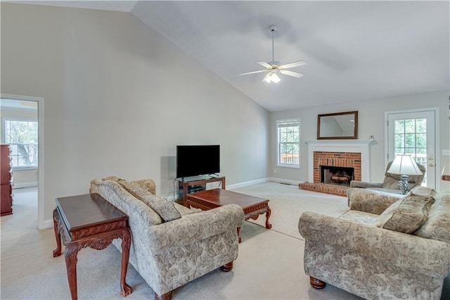 living room with baseboards, ceiling fan, light carpet, and high vaulted ceiling