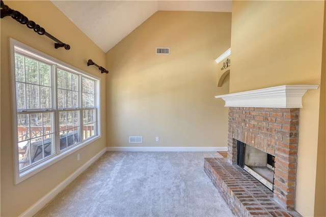 unfurnished living room featuring a brick fireplace, visible vents, and baseboards