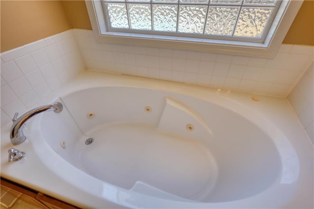 full bathroom with a wealth of natural light and a tub with jets