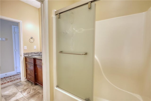 full bathroom with vanity and an enclosed shower