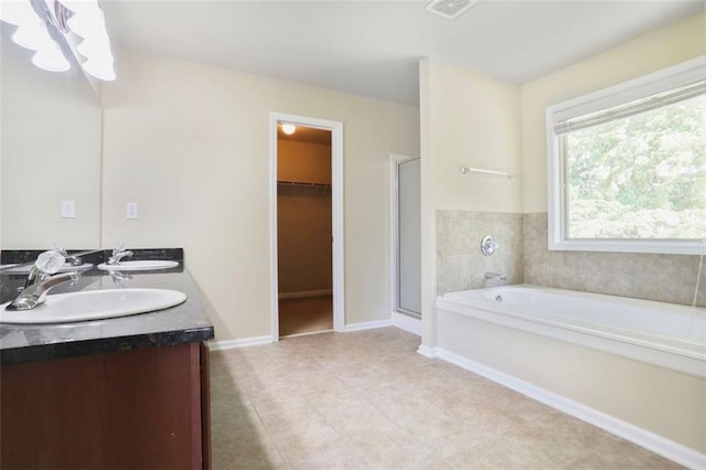 full bath featuring tile patterned flooring, visible vents, a sink, and a stall shower