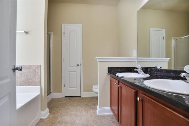 bathroom with a stall shower, a garden tub, a sink, and tile patterned flooring