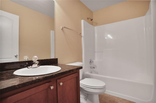 bathroom featuring toilet, tile patterned floors, tub / shower combination, and vanity