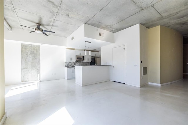 kitchen with finished concrete floors, visible vents, stainless steel appliances, and open floor plan