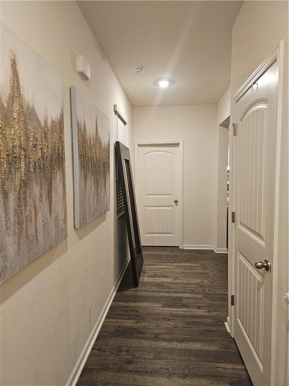 hall with dark hardwood / wood-style flooring